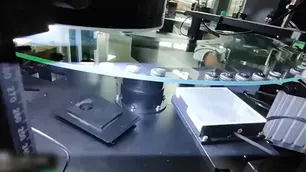 نظام فحص بصري لأزرار الملابس والكبكات